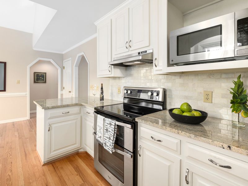 Refinished white kitchen cabinets